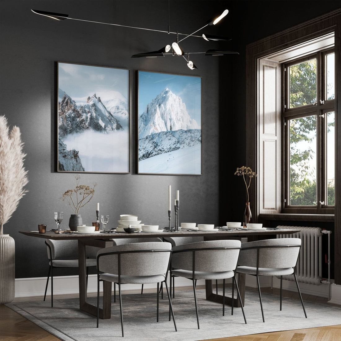 Elegant dining room with framed Aiguille du Midi and Grands Montets mountain prints.