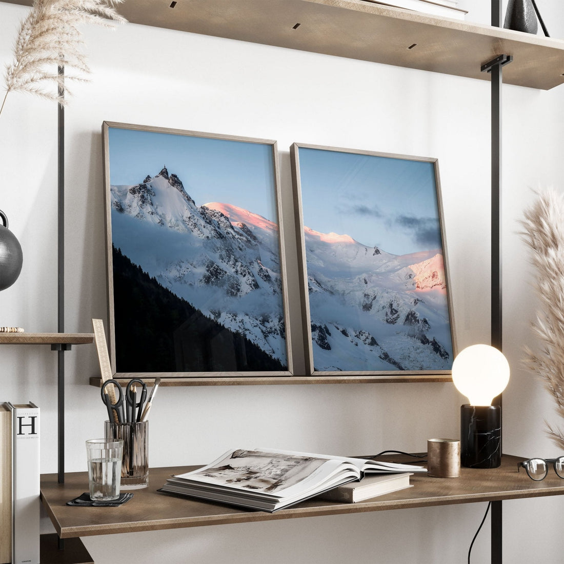 Aiguille du Midi and Mont Blanc framed art leaning on a shelf, styled with books and decor