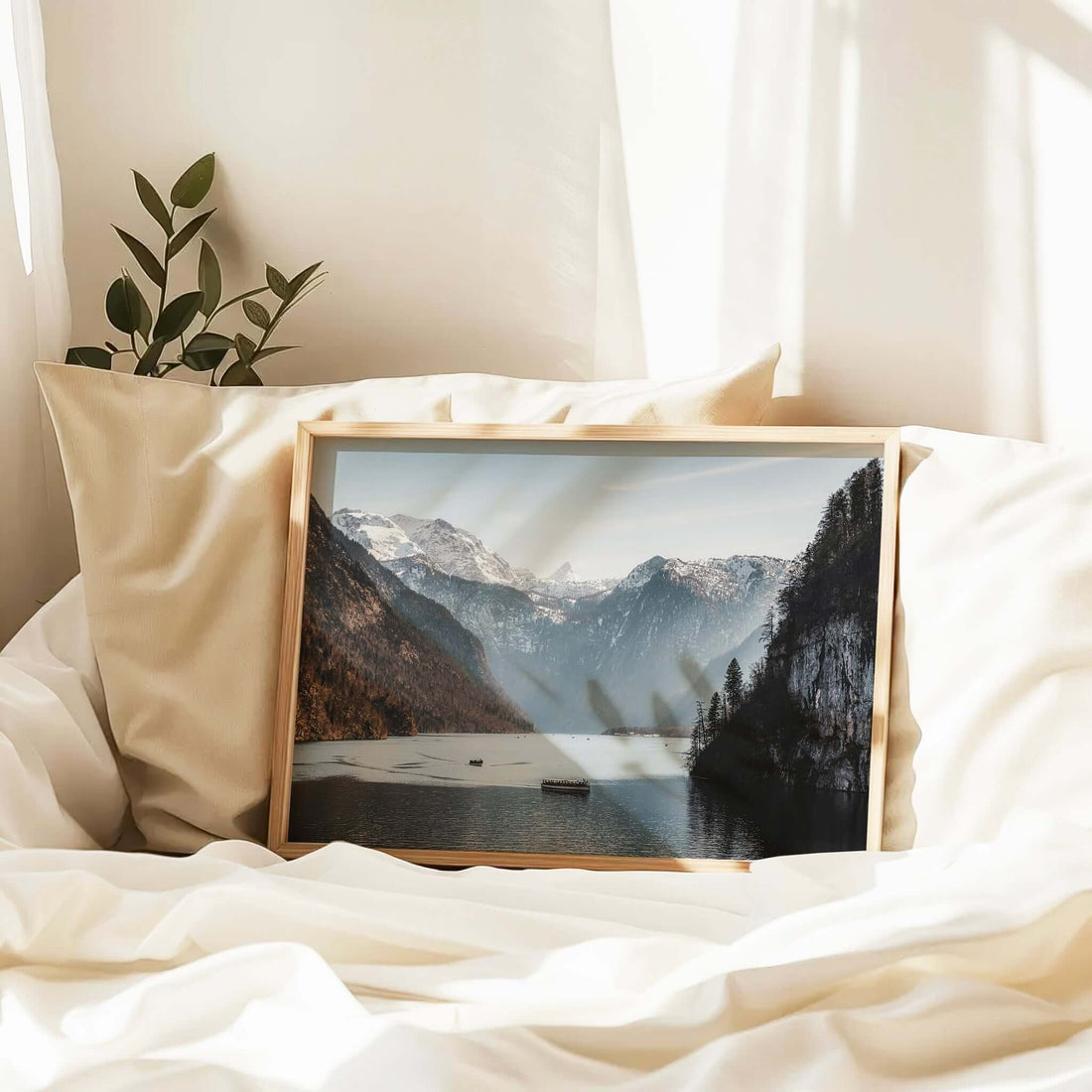 Framed photography of Königssee lake with boats and distant snowy mountains