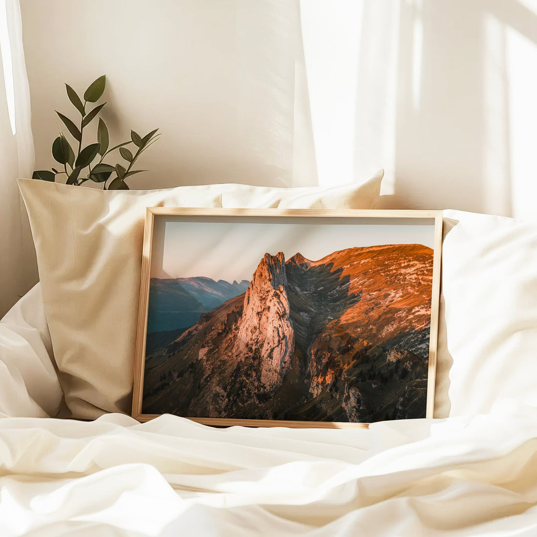 Framed alpine print of Saxer Lücke at dawn, with glowing cliffs and serene Swiss mountain slopes.