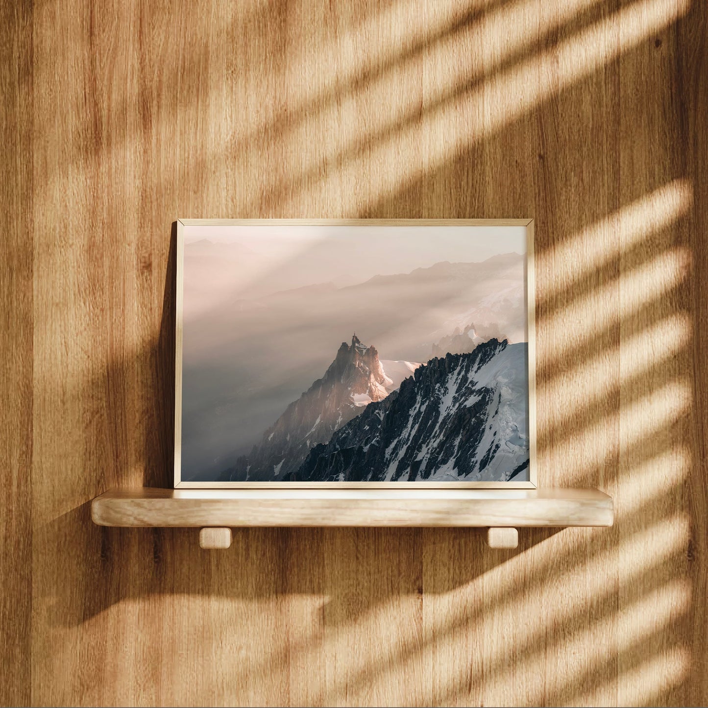 Wall art print of Aiguille du Midi rising from the mist, viewed from the Mont Blanc Massif above Chamonix.