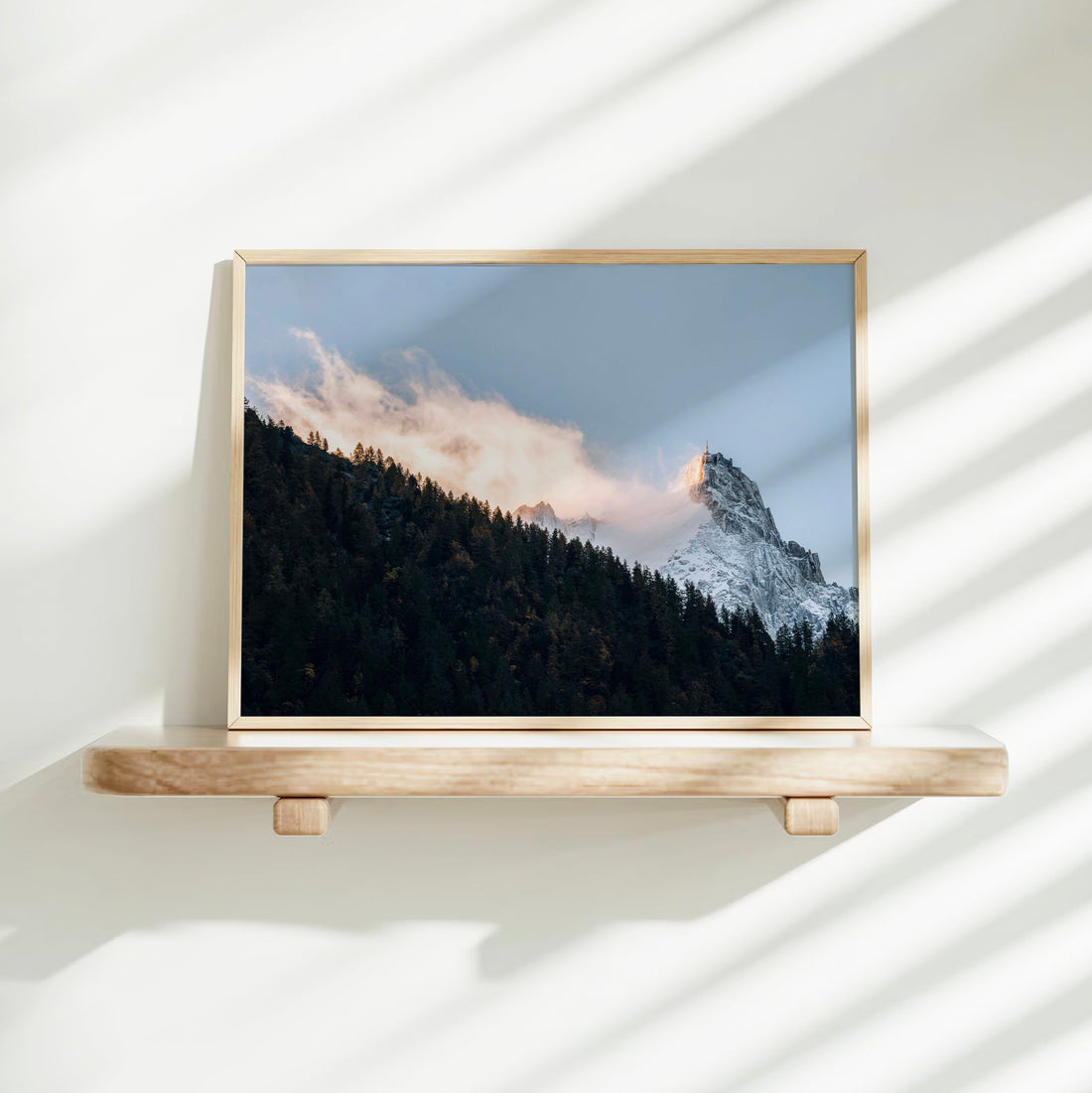 A fine art landscape print capturing the snowy Aiguille du Midi glowing above Chamonix at dusk.