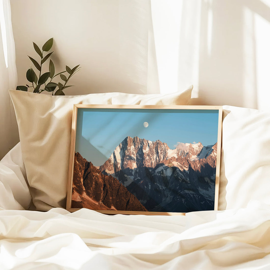 Evening mountain photography print of Grandes Jorasses, with warm light and a visible moon over Chamonix.