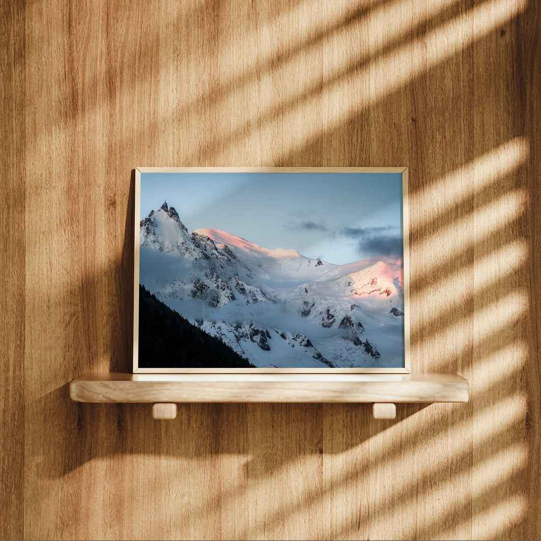 Landscape photo print of snow-covered glaciers and rugged peaks in the French Alps at golden hour.