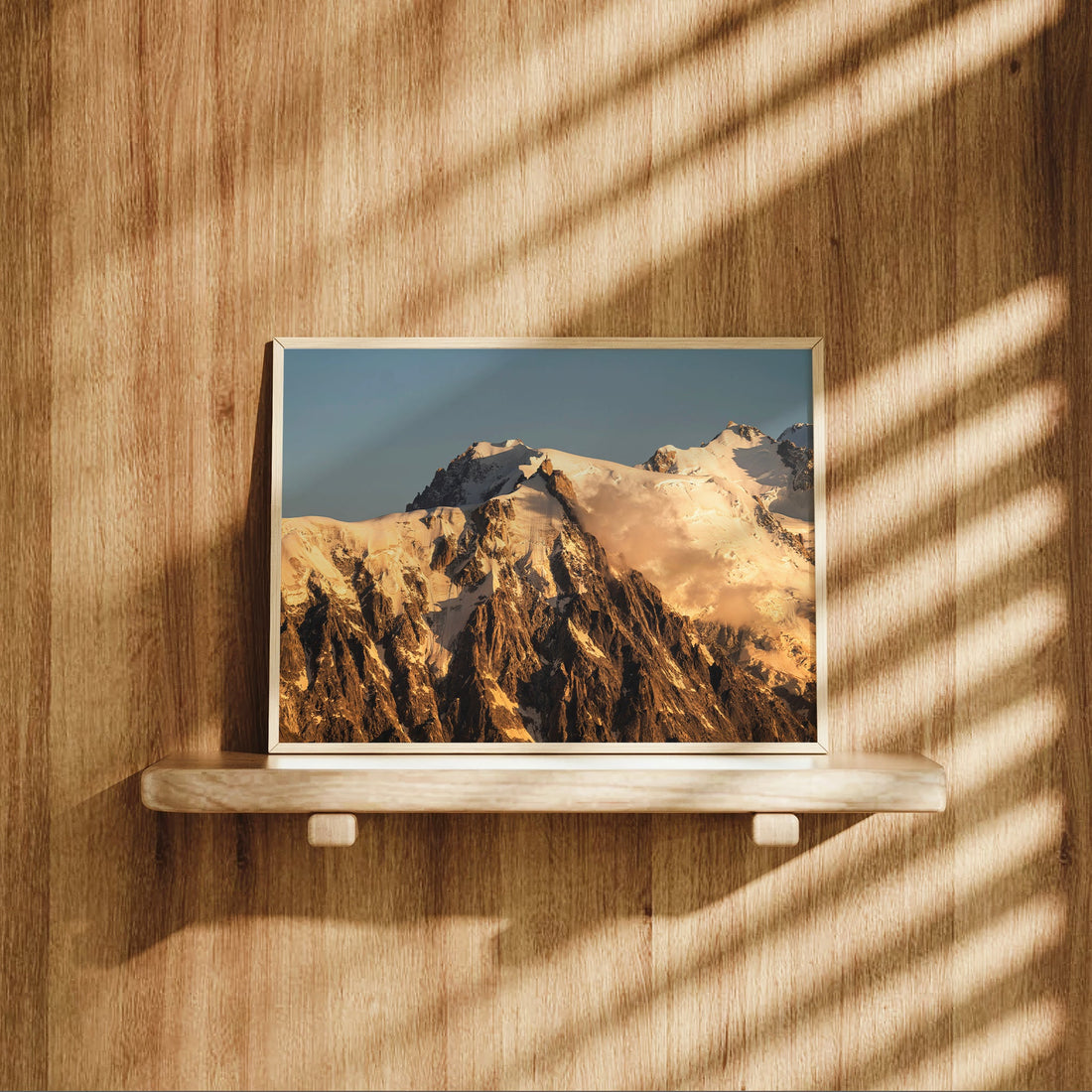 Golden hour photograph of Aiguille du Midi and the snowy peaks of the French Alps, ideal for modern alpine wall art.