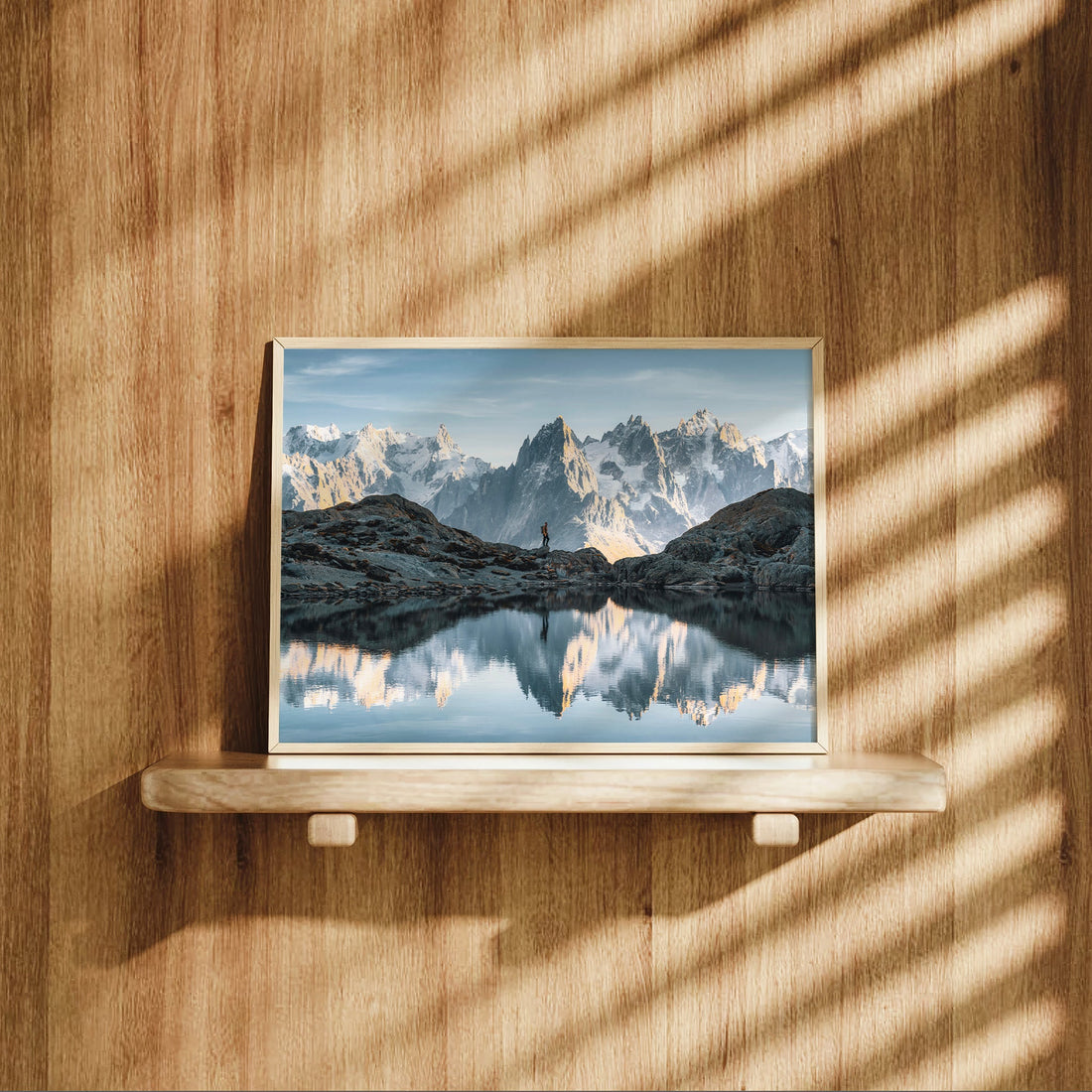 Scenic French Alps art print with a peaceful alpine lake and a distant hiker framed by snow-capped peaks.