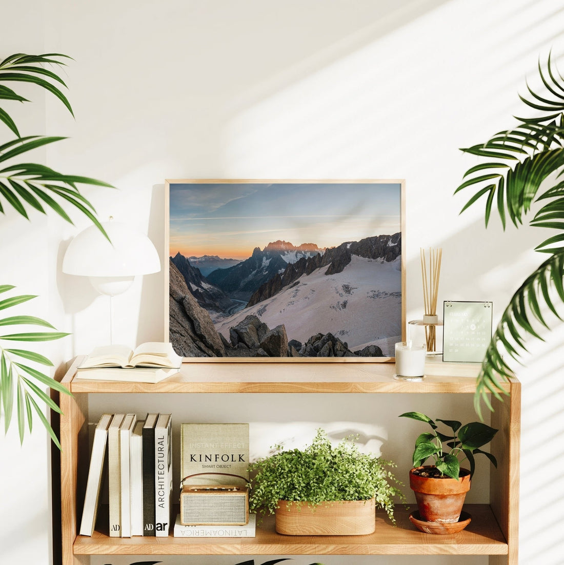 Landscape photography print of the Mer de Glace glacier with sunset light casting soft hues on the mountains.