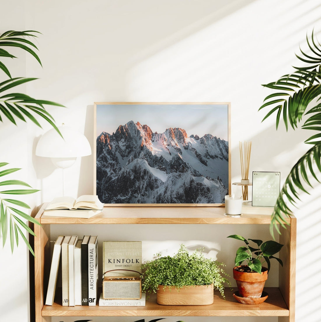 Photography print of the French Alps at dawn featuring jagged ridgelines and soft pink light in Chamonix.