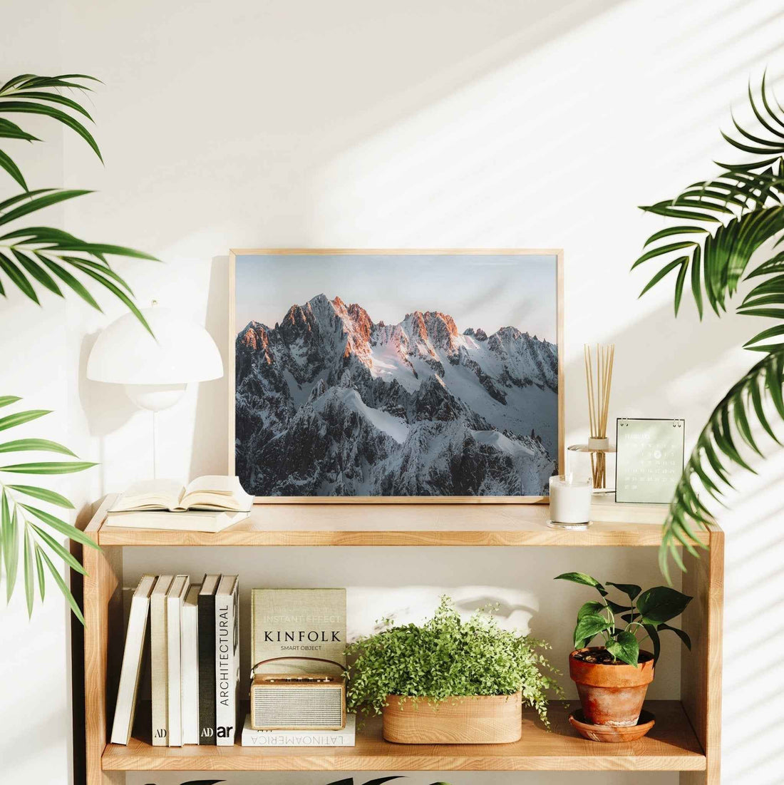 Photography print of the French Alps at dawn featuring jagged ridgelines and soft pink light in Chamonix.