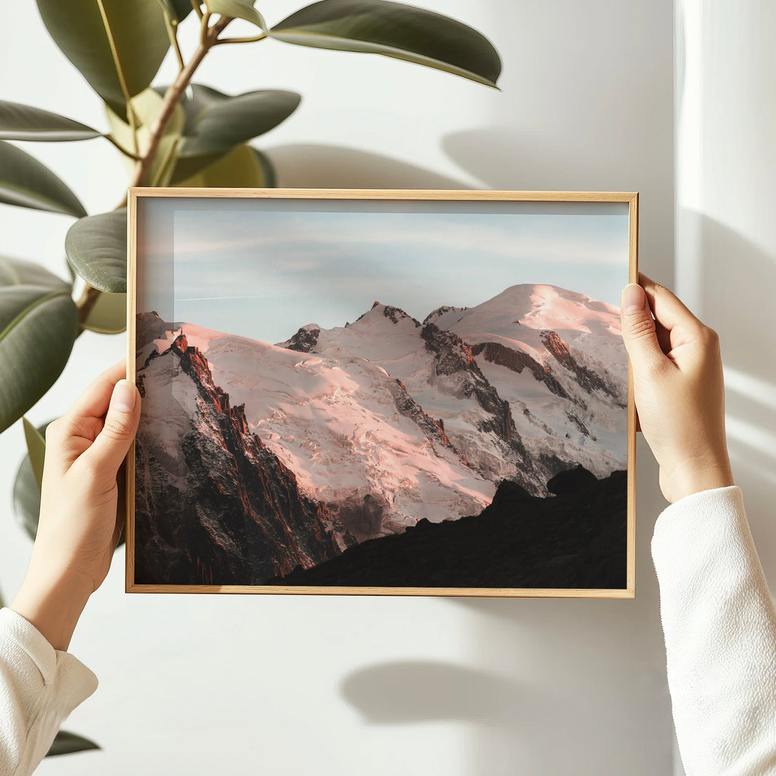 Fine art photo of snow-drenched Mont Blanc Massif basking in golden hour light over the French Alps.