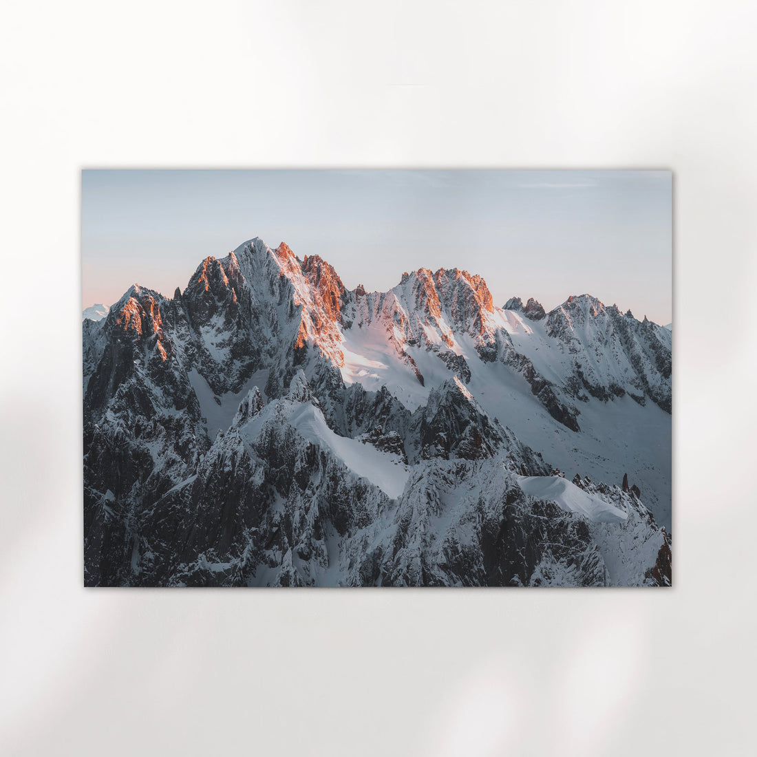 Dramatic sunrise over the snowy peaks of the French Alps captured in this Chamonix landscape photography print.