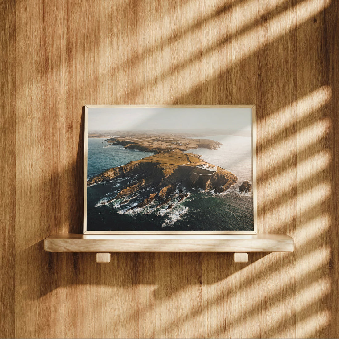 Galley Head lighthouse photo print styled on a wooden shelf