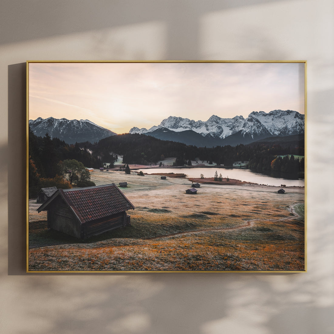 View over Geroldsee with alpine huts and mountains at sunrise in Bavaria