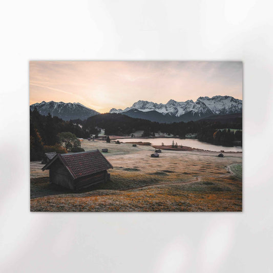Sunset light over Geroldsee lake with reflections and distant peaks in Germany
