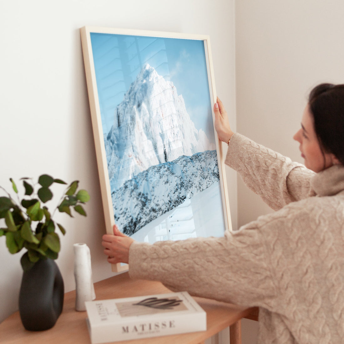 Ski tourers crossing a high-altitude glacier in the Mont Blanc Massif, framed by majestic snow-covered peaks.