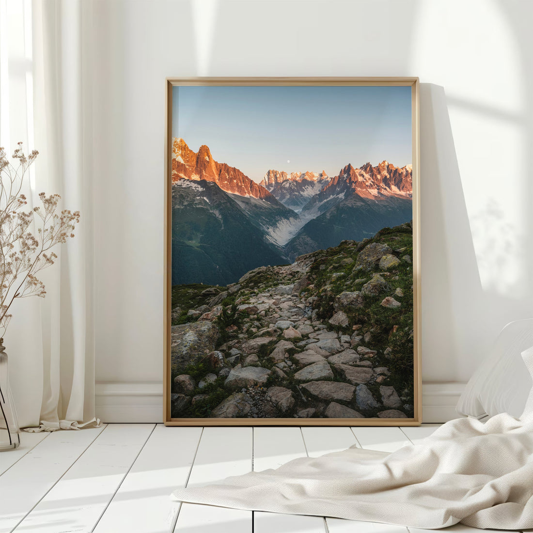 A dramatic trail leading to a glacier in the French Alps, captured in warm sunset tones.