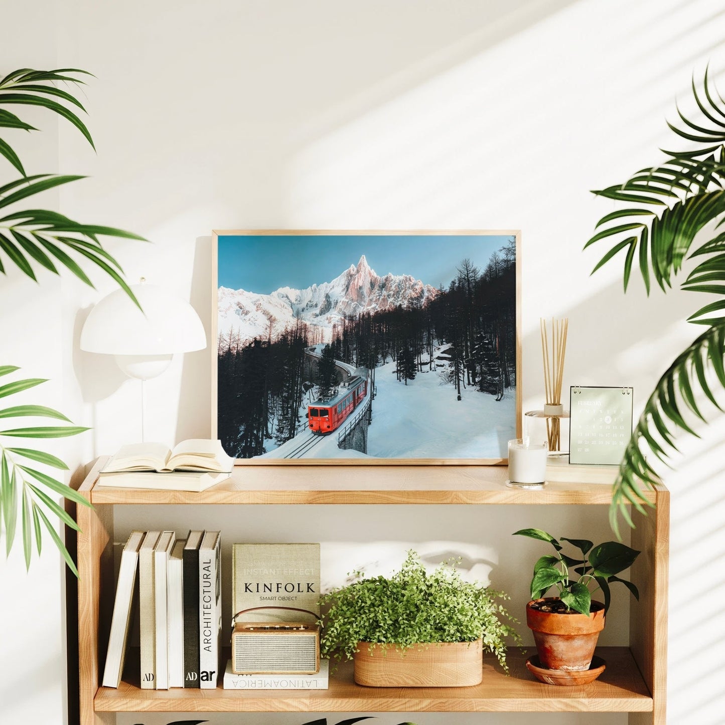 French Alps wall art print of a glacier train snaking through frosty pine trees beneath Mont Blanc.