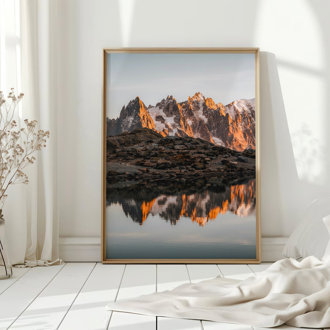 Mont Blanc bathed in golden light, mirrored in Lac Blanc’s waters. A captivating high-altitude photography print.
