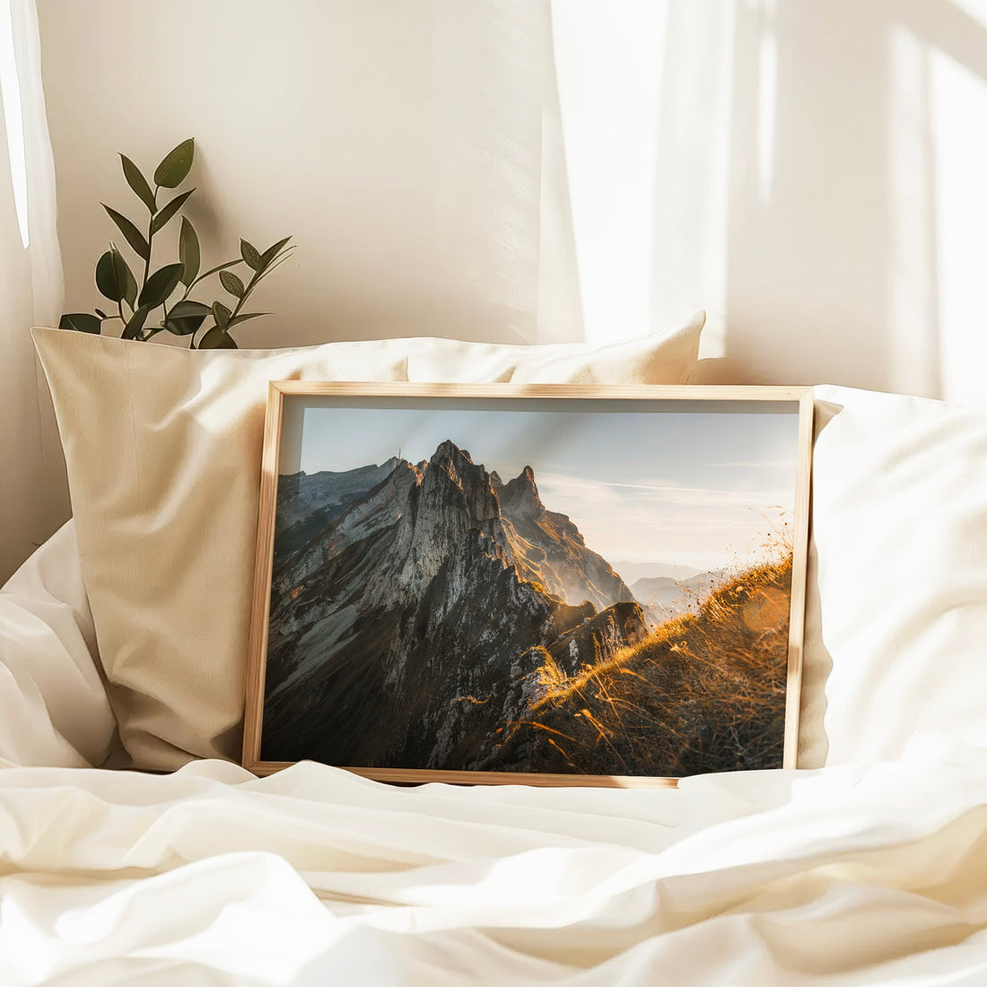Schäfler photo print capturing warm golden-hour light cascading over Swiss ridge lines and grassy slopes.