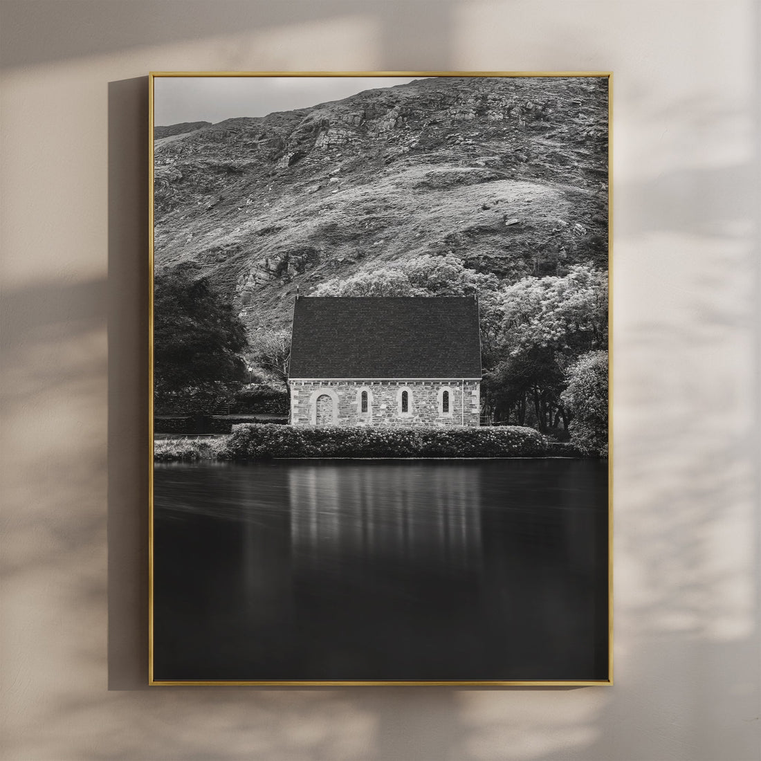 Black and white photo of Gougane Barra chapel reflecting on still lake