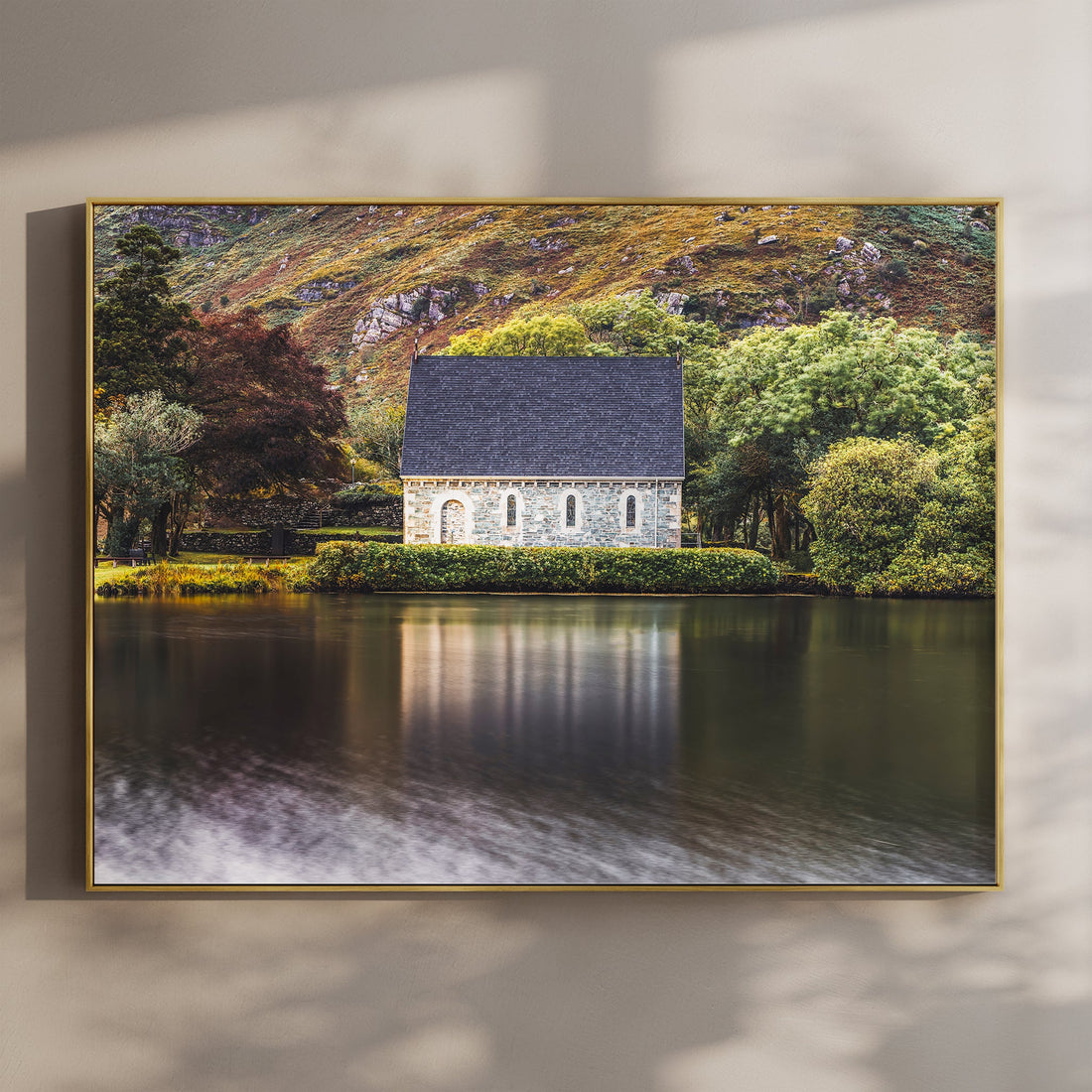 Framed print of Gougane Barra chapel by the water during golden hour