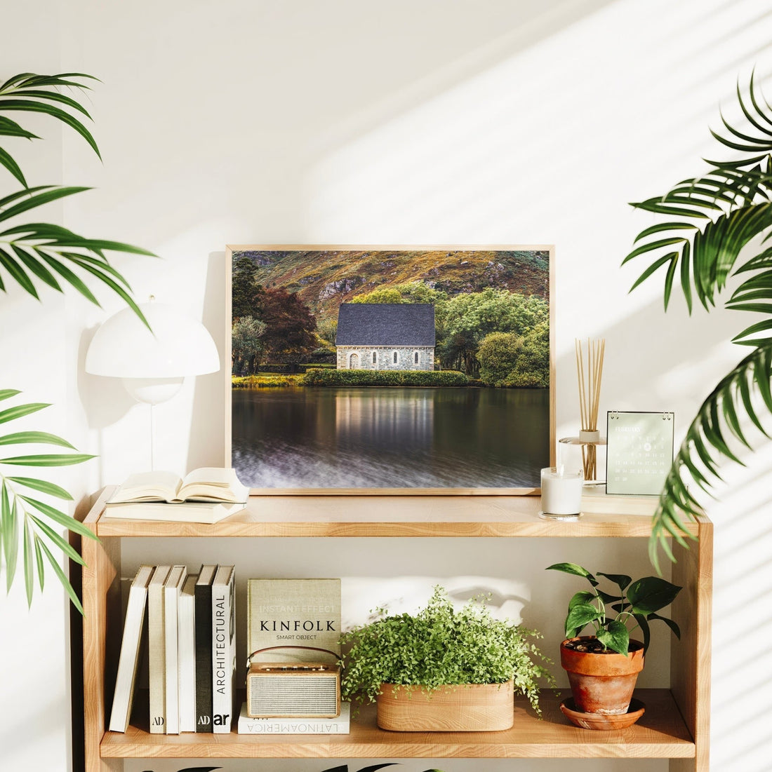 Gougane Barra chapel landscape print styled with houseplants and books