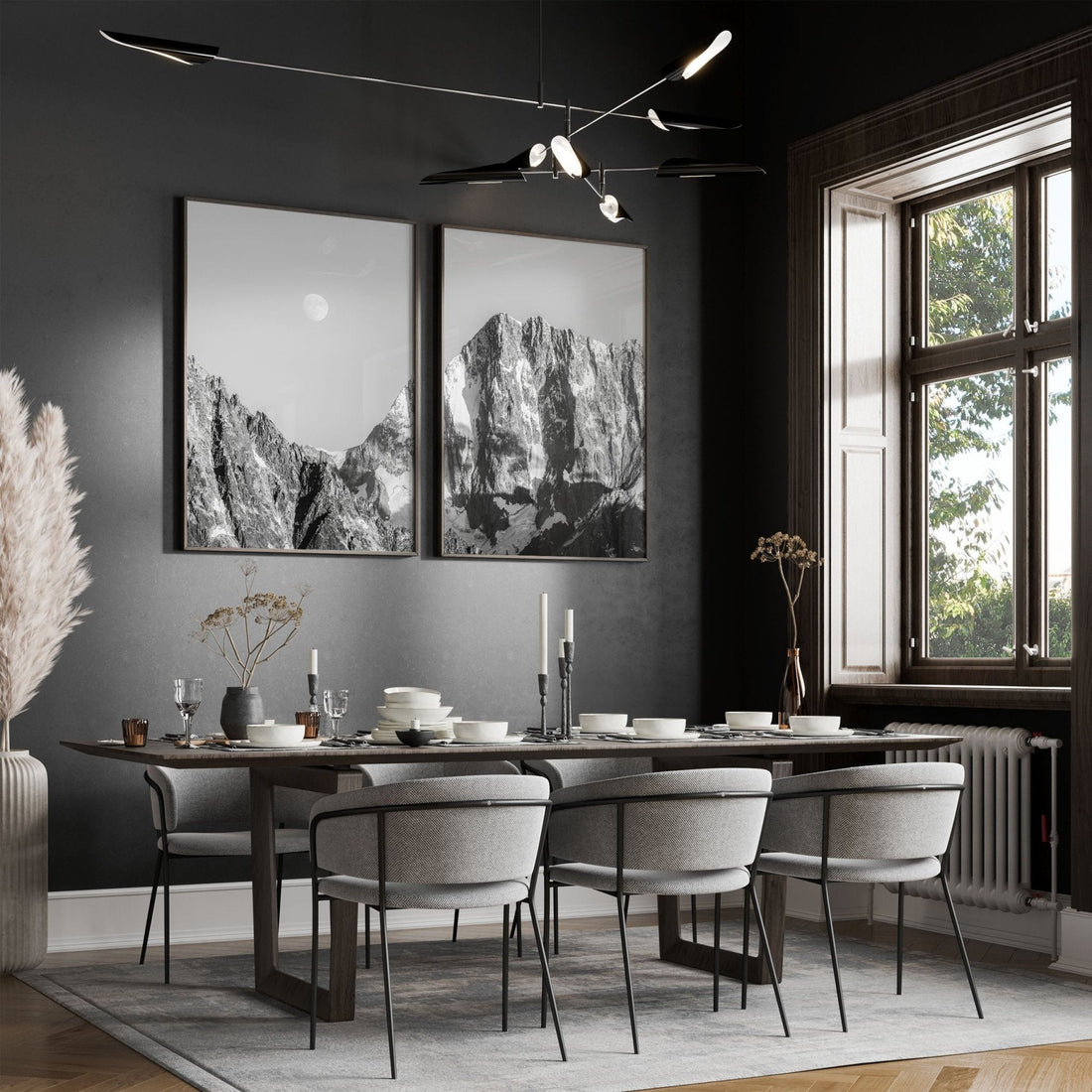 Black and white photo of Grandes Jorasses displayed in a dining room with elegant decor