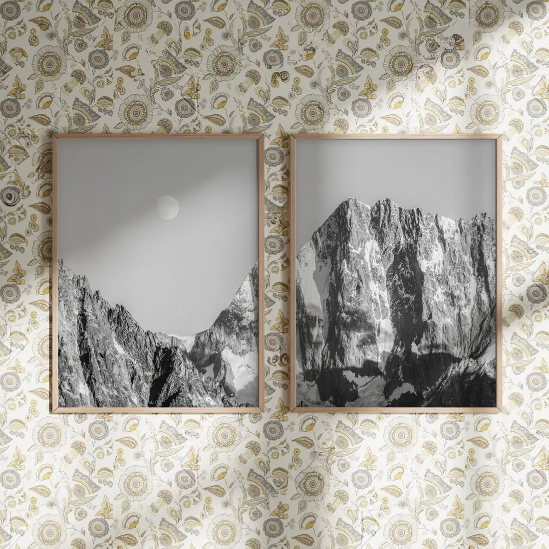 Black and white Grandes Jorasses print on a patterned wallpaper background.