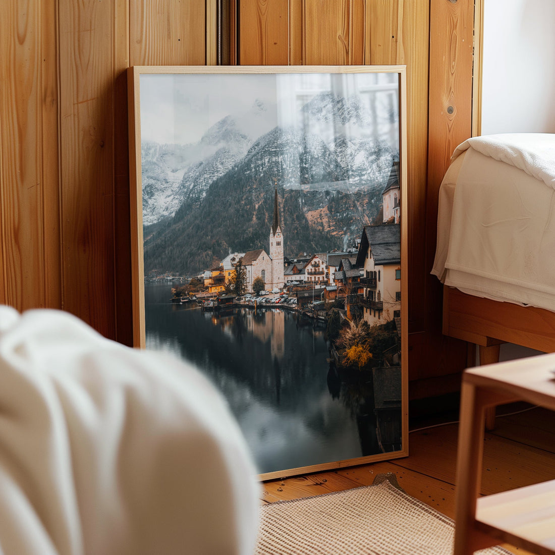 Hallstatt village framed wall print leaning on wood panel wall