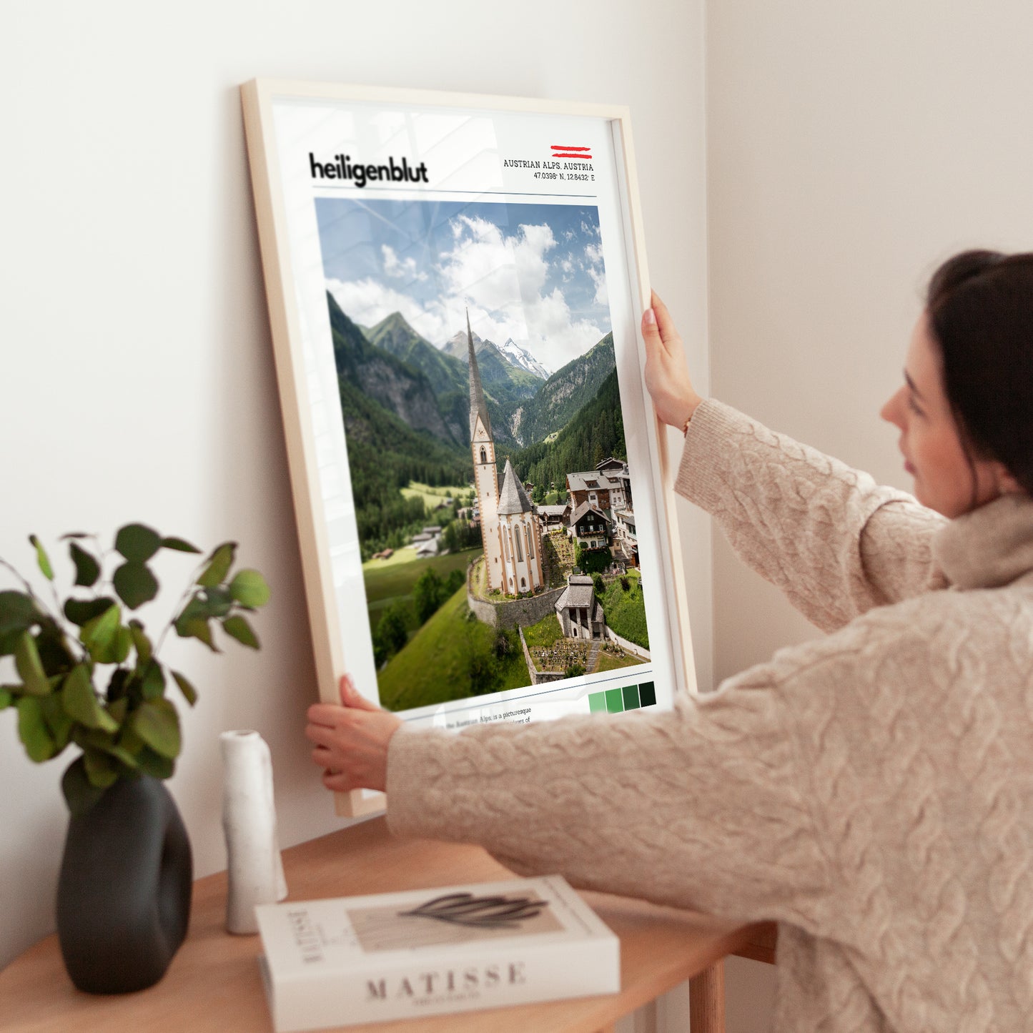 Close view of a Heiligenblut Austrian Alps poster being adjusted in a frame