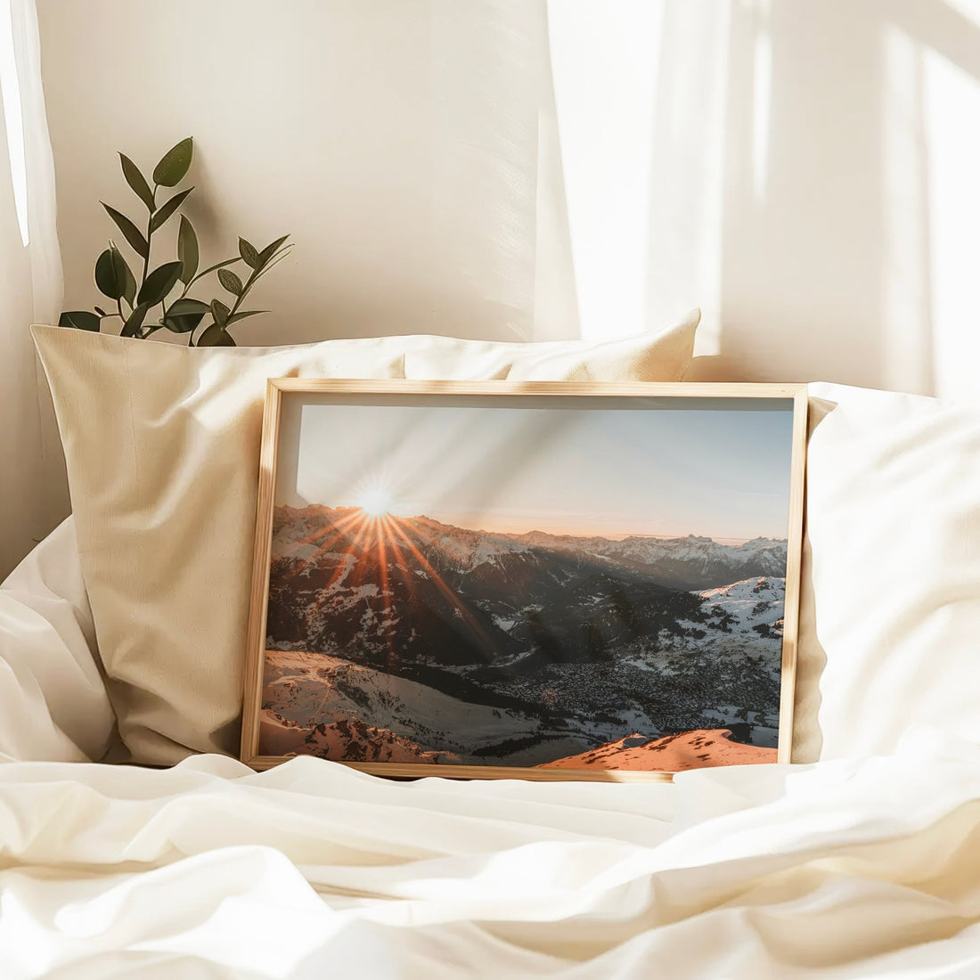 Stunning high-altitude view of Verbier with golden light casting across snowy slopes and distant ranges.