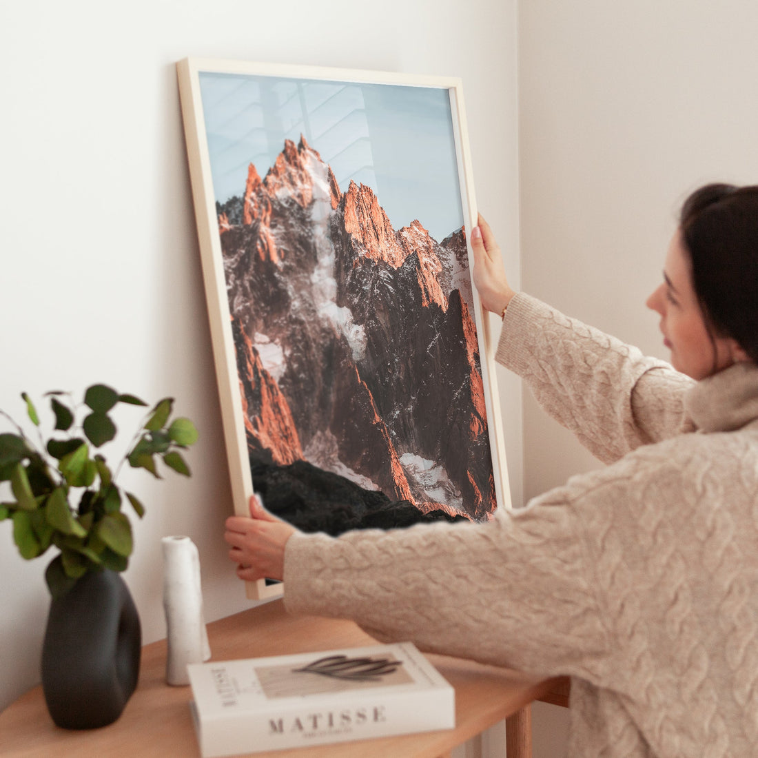 Minimalist mountain photography print of the Aiguille de Chamonix, featuring striking contrasts and warm tones.