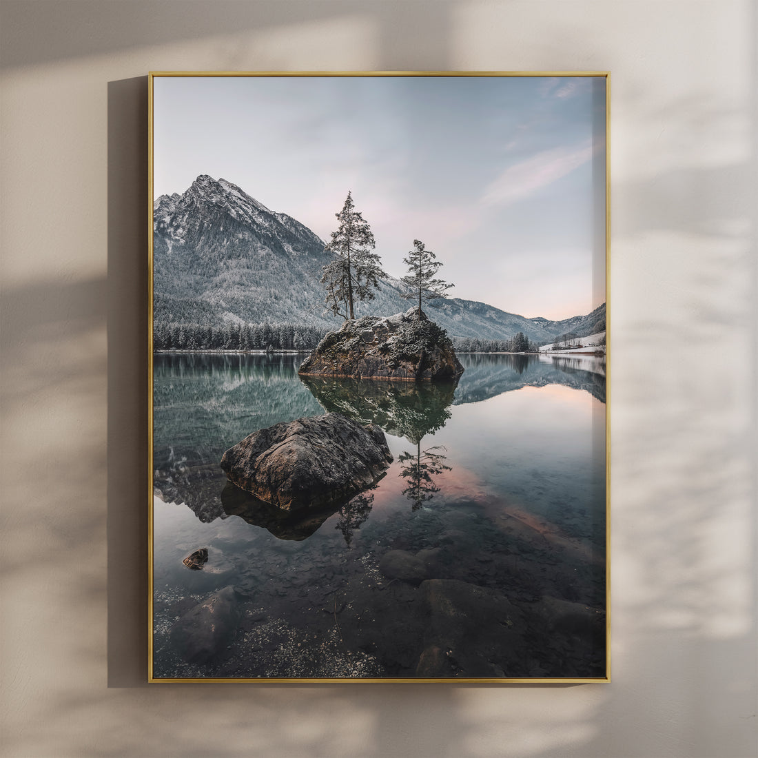 Peaceful morning reflections on Hintersee lake in the Bavarian Alps