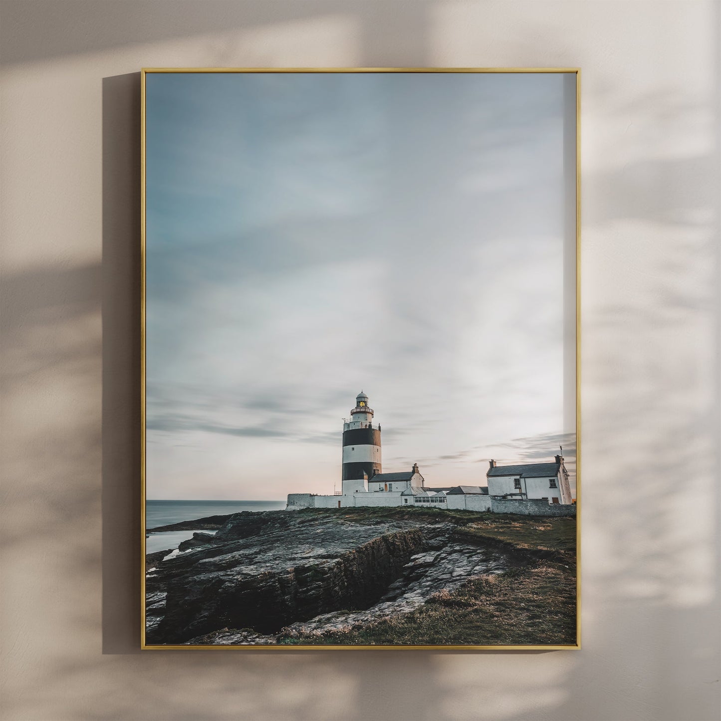 Hook Head Lighthouse wall art print featuring golden light on a coastal scene