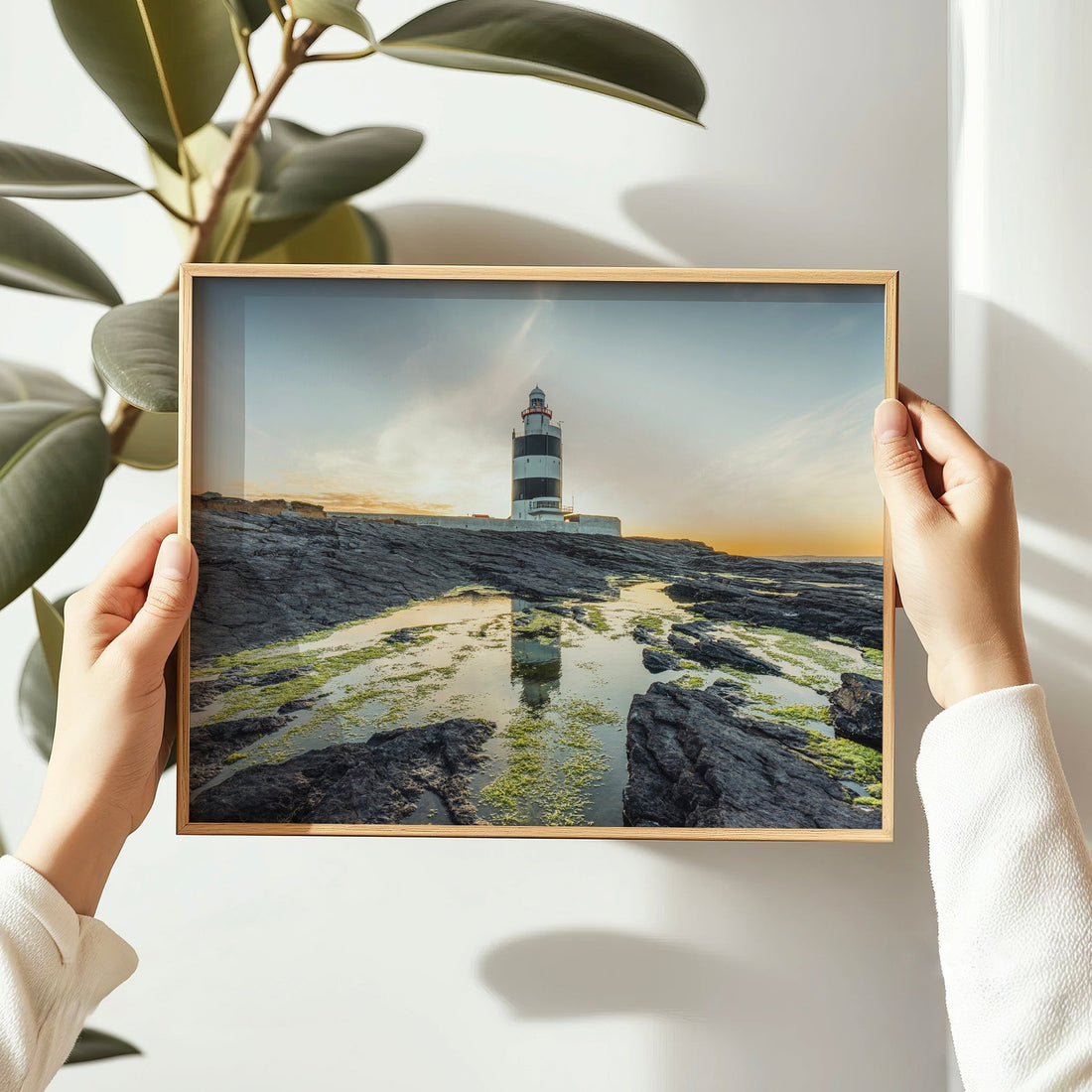 Sunset reflecting off water near Hook Head Lighthouse in Ireland.
