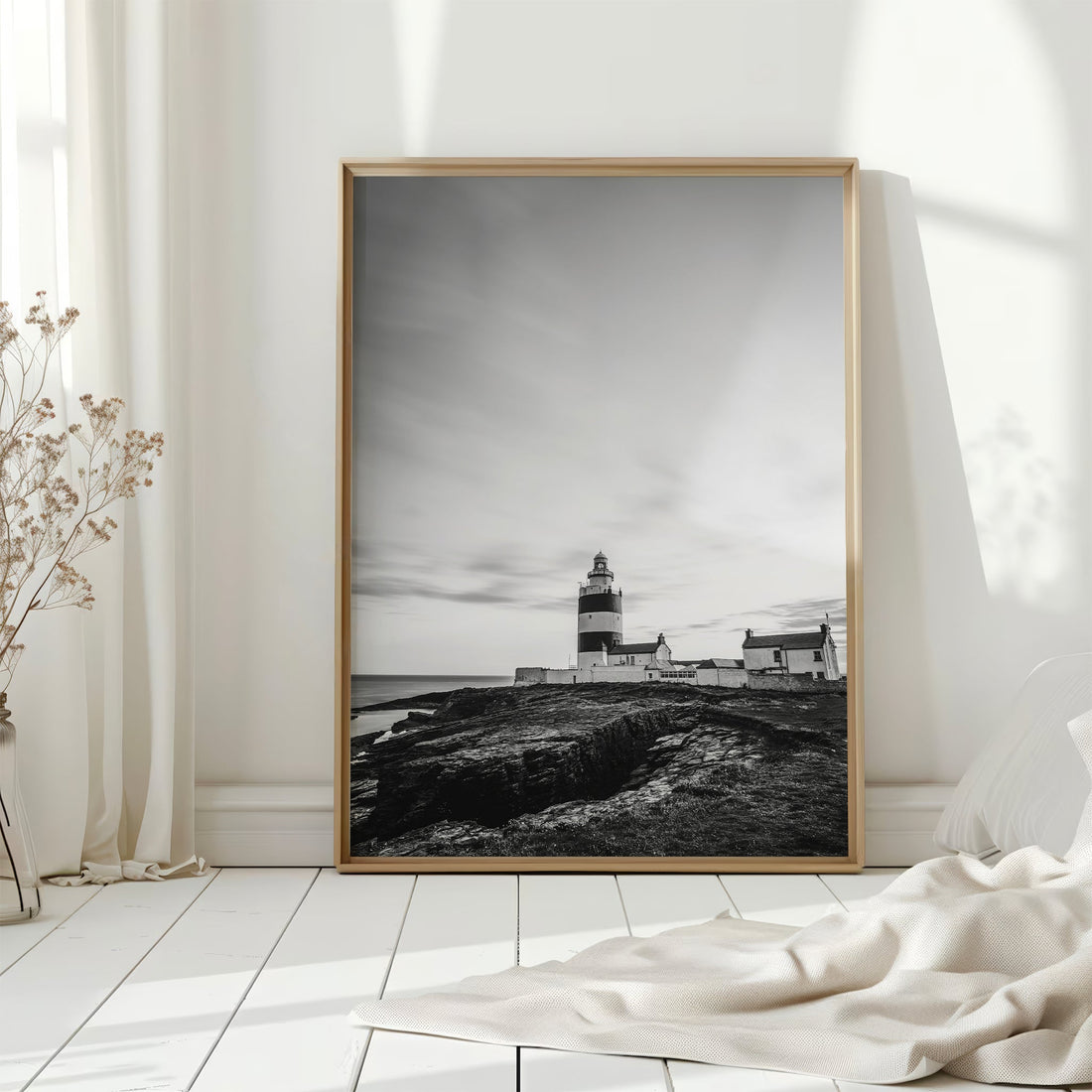 Minimalist white room featuring Hook Head Lighthouse framed artwork