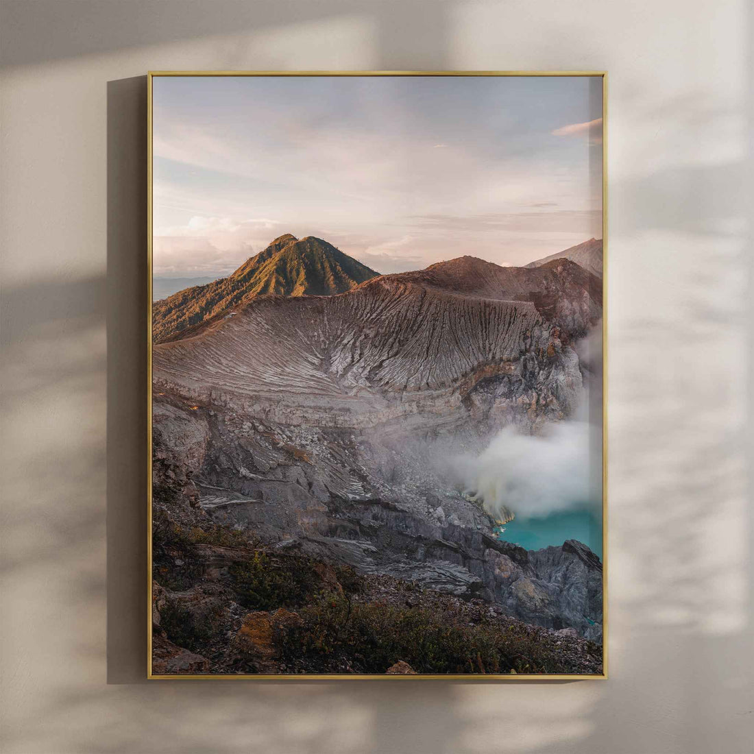Ijen volcano crater lake Java Indonesia wall art print in gold floating frame mounted on beige wall with natural shadows