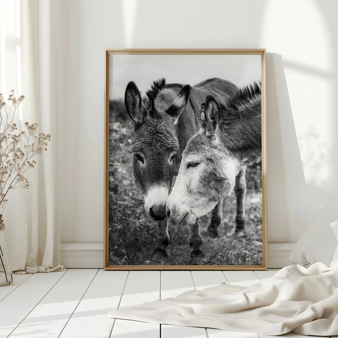 Framed Irish donkey art on a white floor with natural light, black and white countryside decor