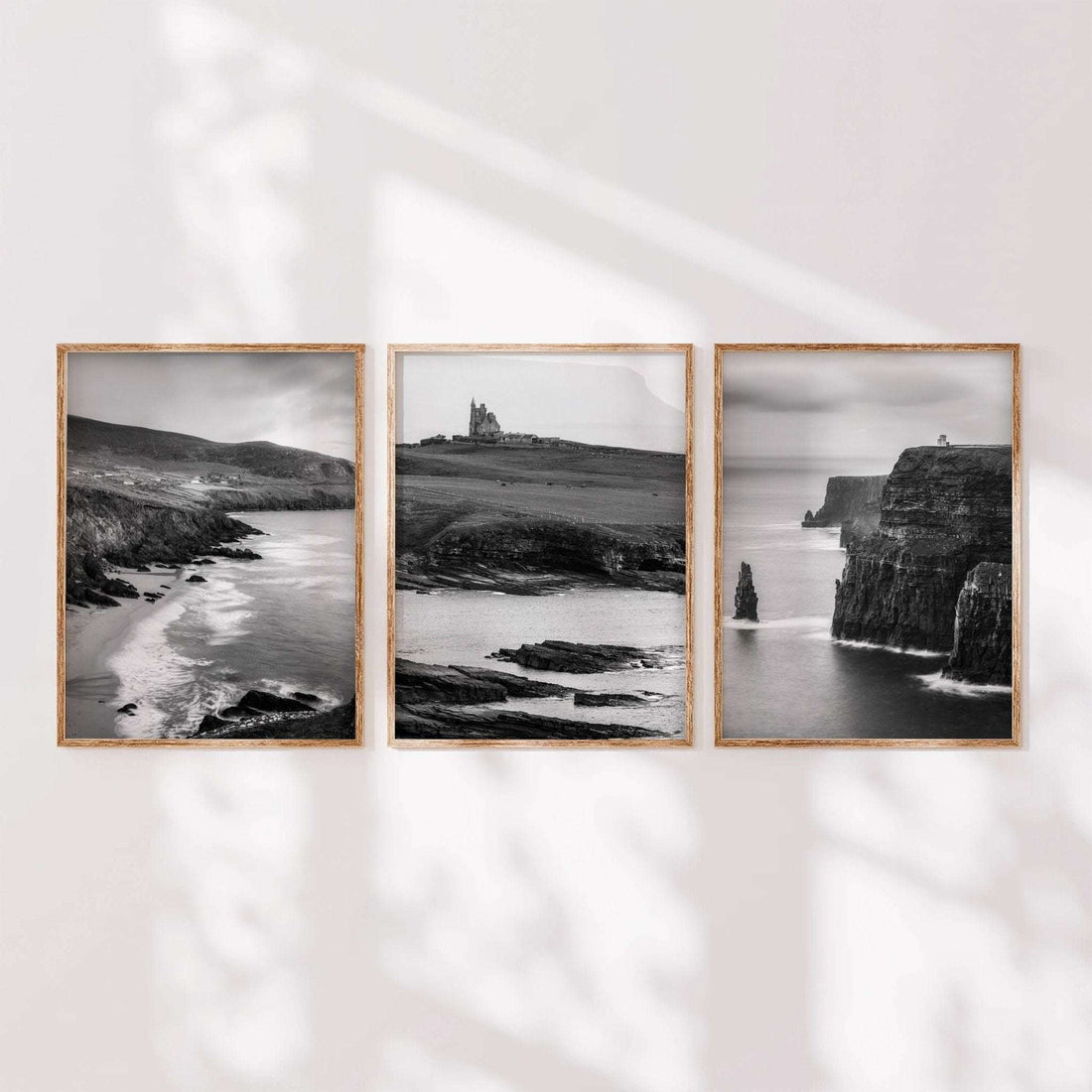 Minimal black and white Irish landscape wall art set of three shown in a calm, modern interior