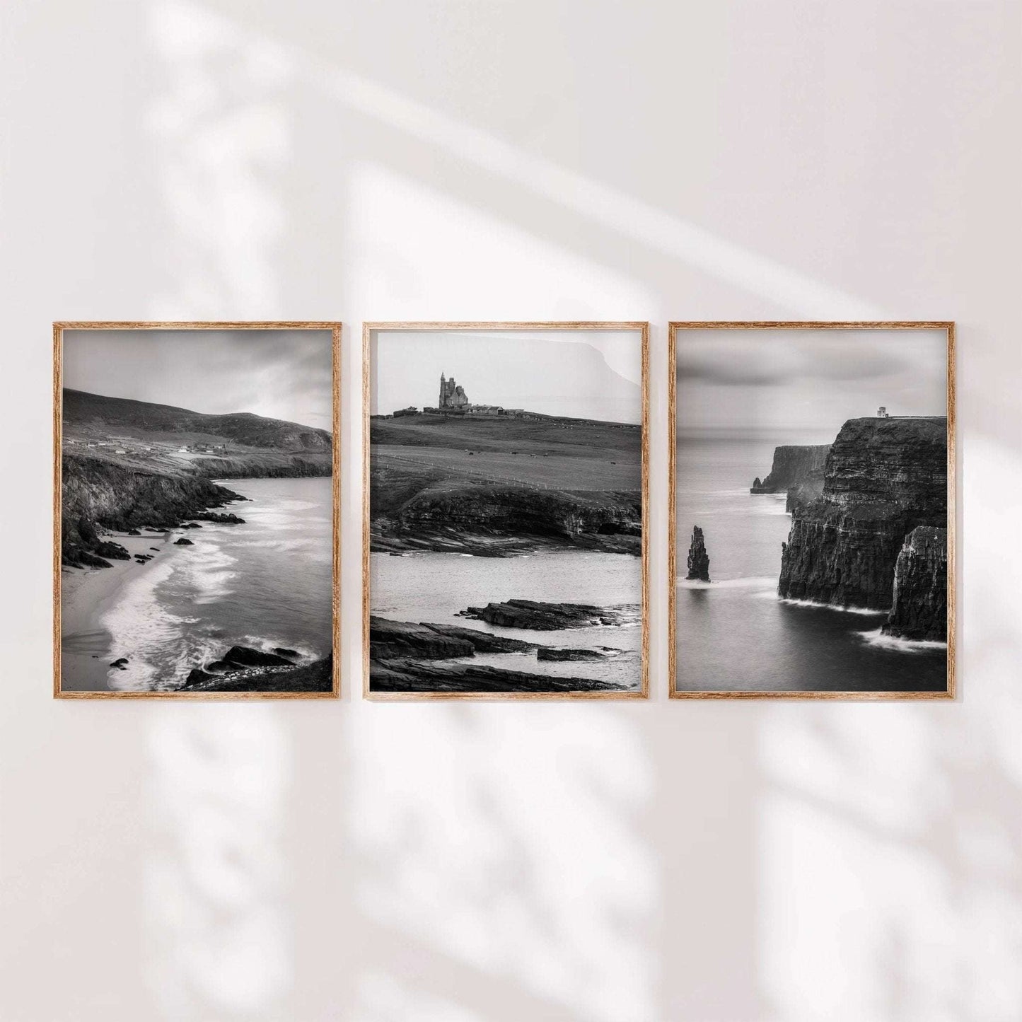 Minimal black and white Irish landscape wall art set of three shown in a calm, modern interior