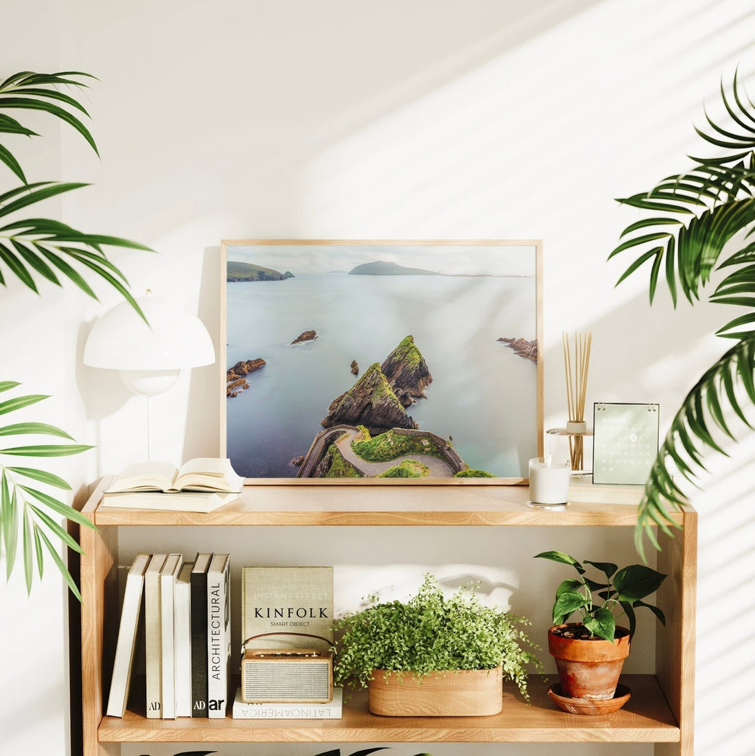 Dunquin seascape print styled with books and houseplants for home decor