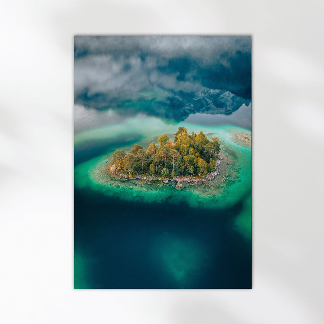 Stunning top-down photograph of Deer Island in Eibsee lake, Germany