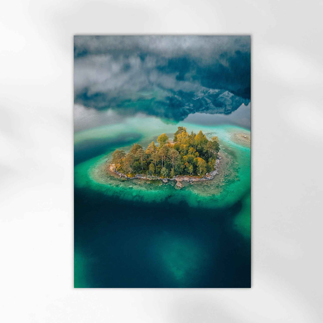 Stunning top-down photograph of Deer Island in Eibsee lake, Germany