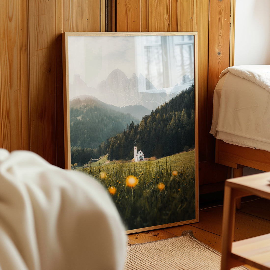 Alpine art print of St. John’s Church in Val di Funes displayed on wooden bedroom wall