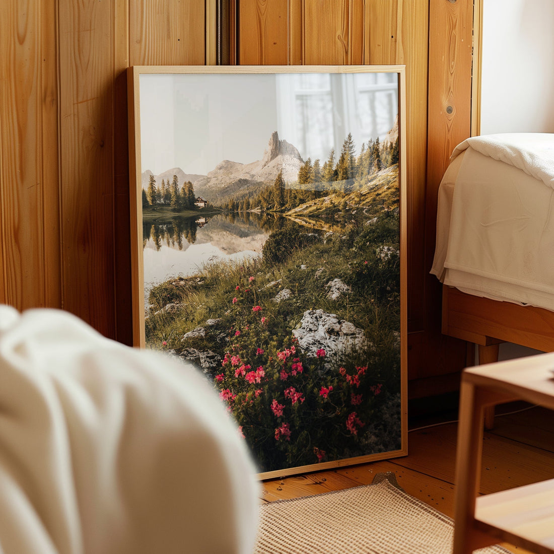 Fine art photo of Lago di Federa with pink blooms, displayed in wooden interior