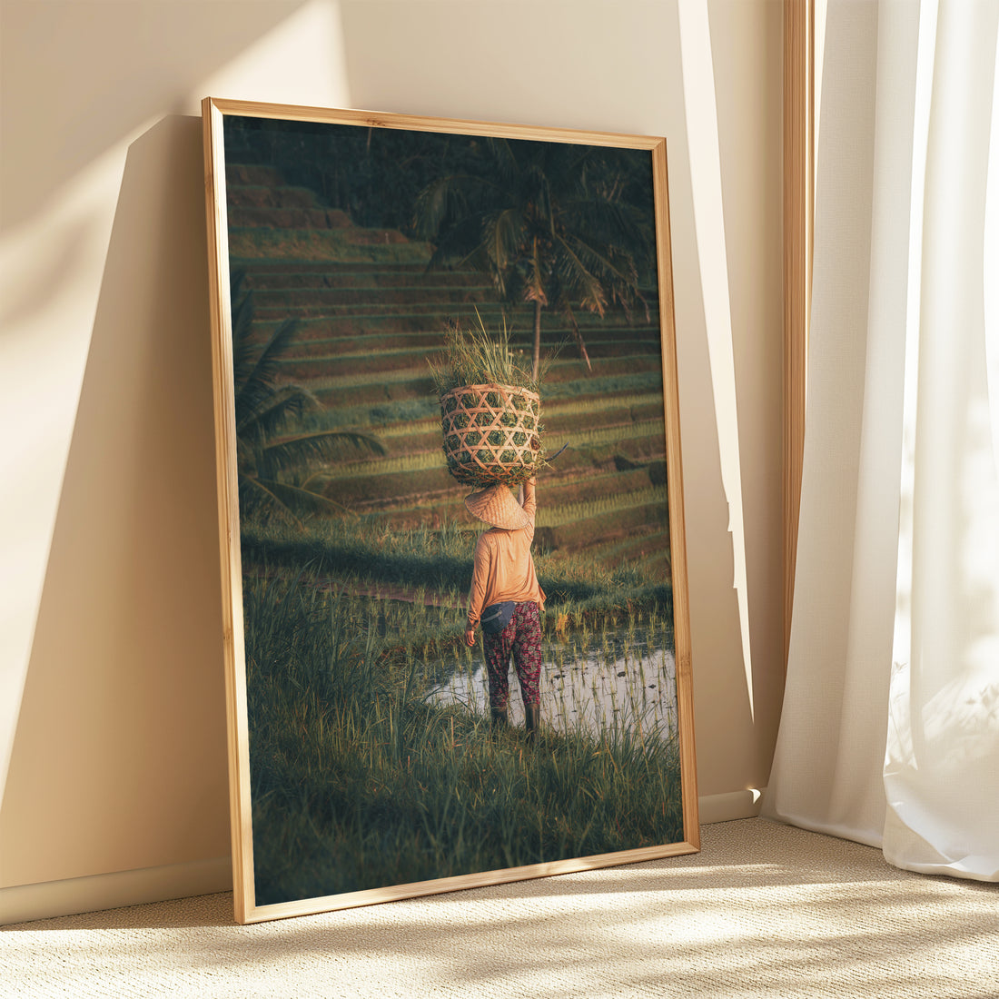 Framed Bali rice fields wall art leaning by a bright window with soft curtains