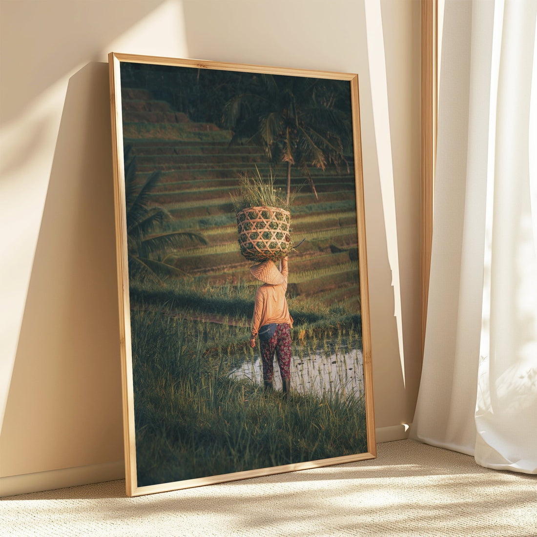 Framed Bali rice fields wall art leaning by a bright window with soft curtains