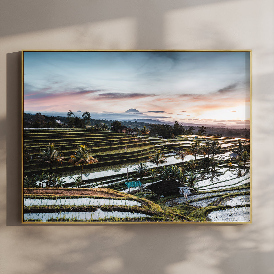 Framed sunrise print of Jatiluwih Rice Terraces Bali Indonesia in a gold float frame mounted on a wall