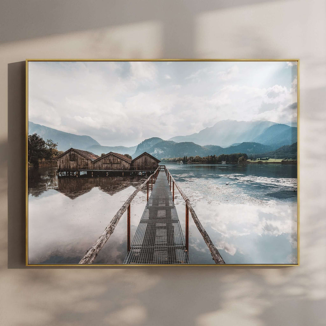 Wooden boathouses on Kochelsee lake with mountain reflections in Bavaria