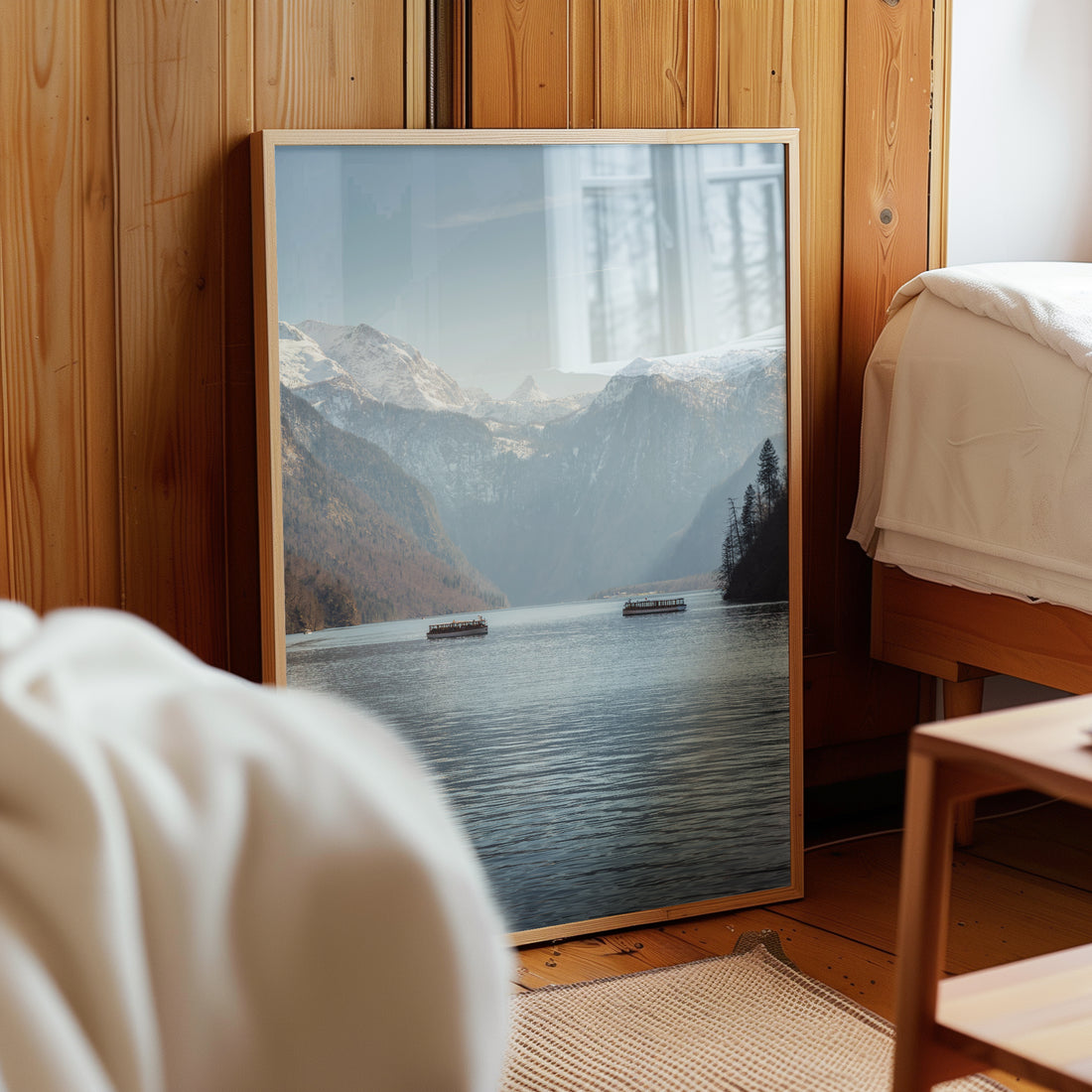 Konigssee lake art print styled beside bed on rustic wooden floor
